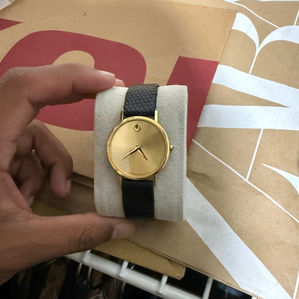 Movado Gold Watch with Black Leather Strap